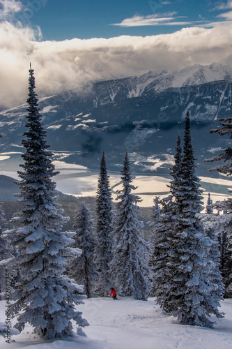 Tree skiing at Revelstoke Mountain Resort, British Columbia Canada, and views of Columbia River Valley