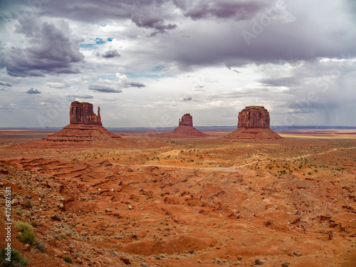 Stormy, scenic view of The Mittens and Merrick Butte from John Wayne's Point in the Oljato Navajo Monument Valley, Arizona, USA photo