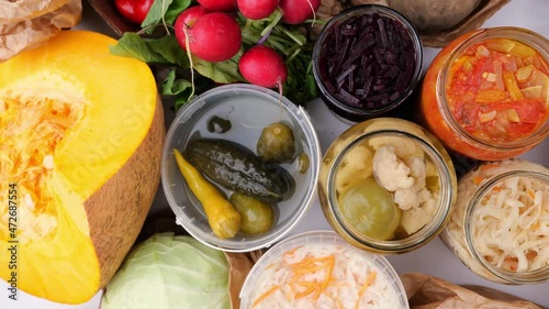 Homemade fermented in glass jars, pickled food healthy vegetables, fruit harvest. Winter fermented and canning superfood concept. Probiotics, enzymes, nutritiion veggy preservation. Selective focus photo