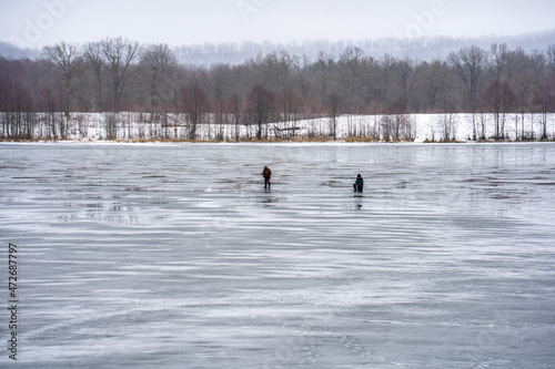 Fishermen on the first thin unreliable ice