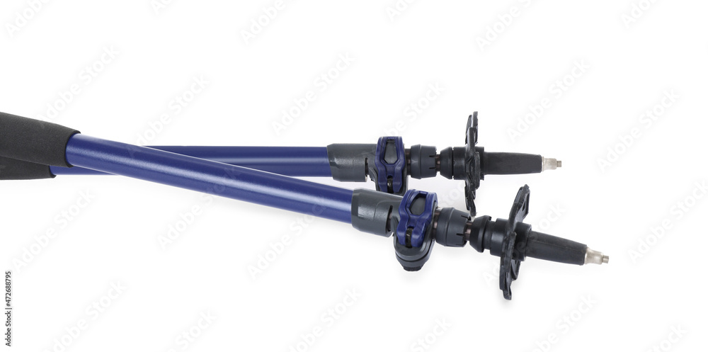 Pair of trekking poles on white background, closeup. Camping tourism Pair of trekking poles on white background, closeup. Camping tourism