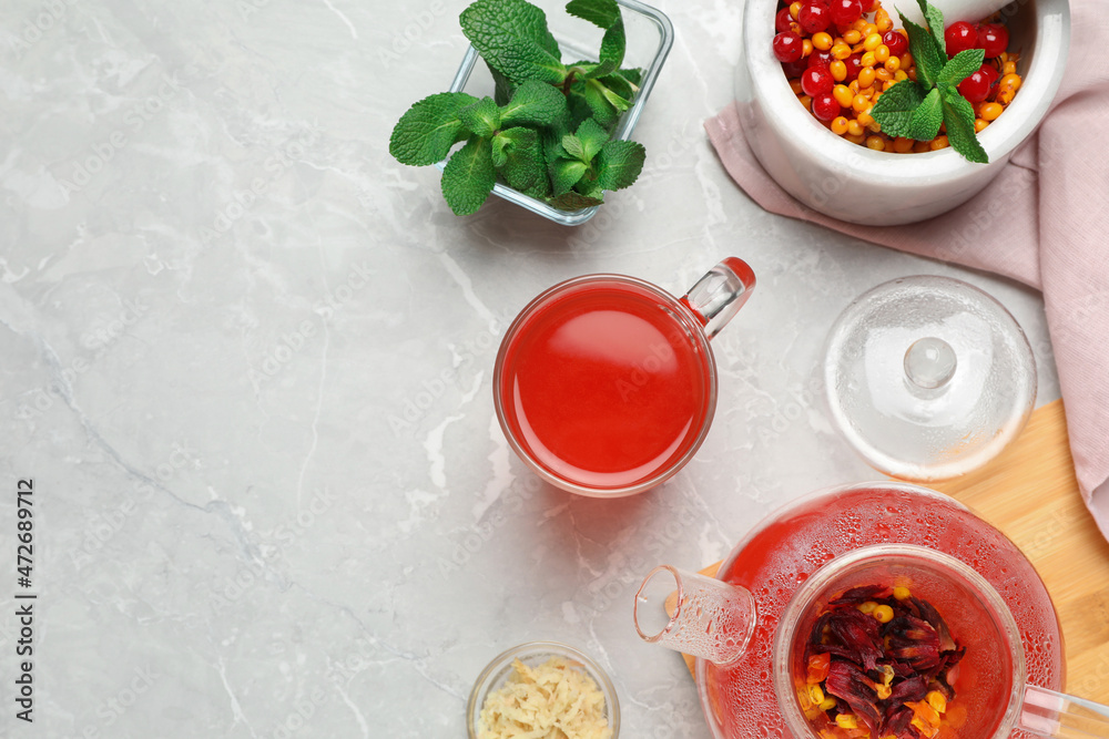 Flat lay composition with immunity boosting drink on light grey marble table. Space for text Flat lay composition with immunity boosting drink on light grey marble table. Space for text