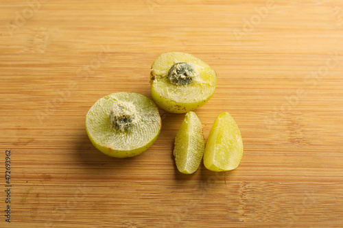 Indian gooseberry slices on white background. photo