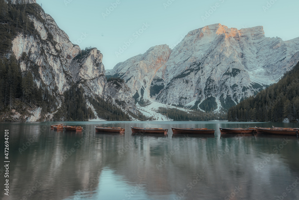 landscape of a lake between mountains with boats
