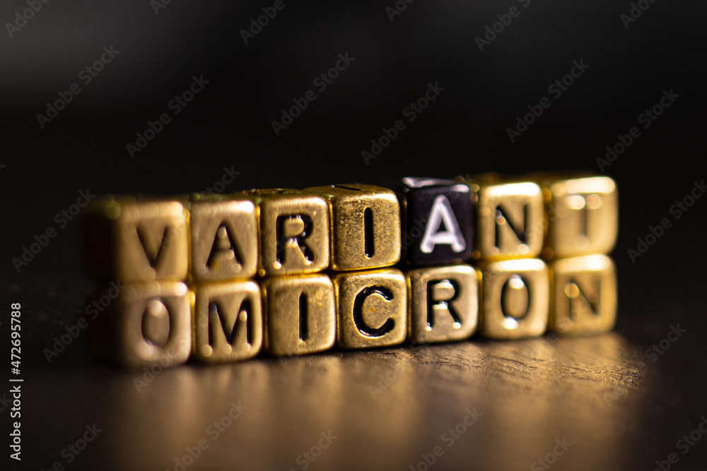 Obraz premium OMICRON Variant name reveal. SARS-CoV-2 Coronavirus Variant Omicron. Black background.