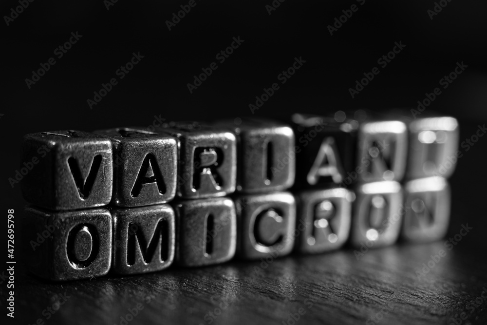 OMICRON Variant name reveal. SARS-CoV-2 Coronavirus Variant Omicron. Black background. OMICRON Variant name reveal. SARS-CoV-2 Coronavirus Variant Omicron. Black background.