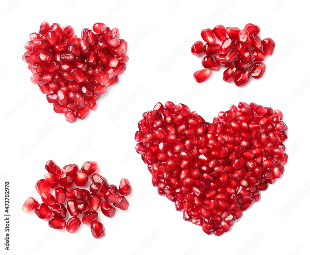 Set with ripe juicy pomegranate seeds on white background, top view Set with ripe juicy pomegranate seeds on white background, top view