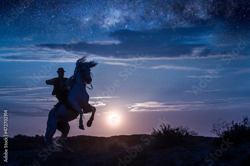 Europe, France, Provence, Camargue. Composite of man on rearing Camargue horse at sunrise.