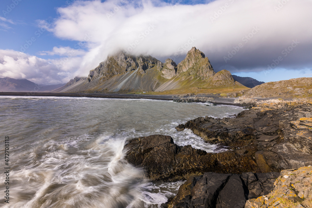 Europe, Iceland. Clouds drape the mountains of Eystrahorn on the south coast.