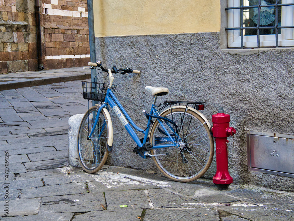 Italy, Tuscany. A blue bicycle in the Tuscan town of Lucca.