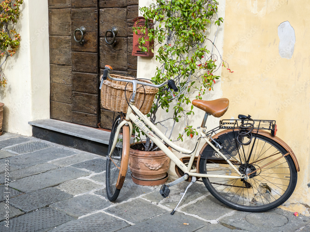Italy, Tuscany. A white bicycle in the Tuscan town of Lucca.