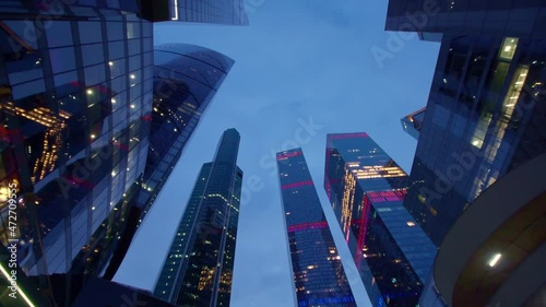 Night view from the bottom up of the skyscrapers and towers of downtown.