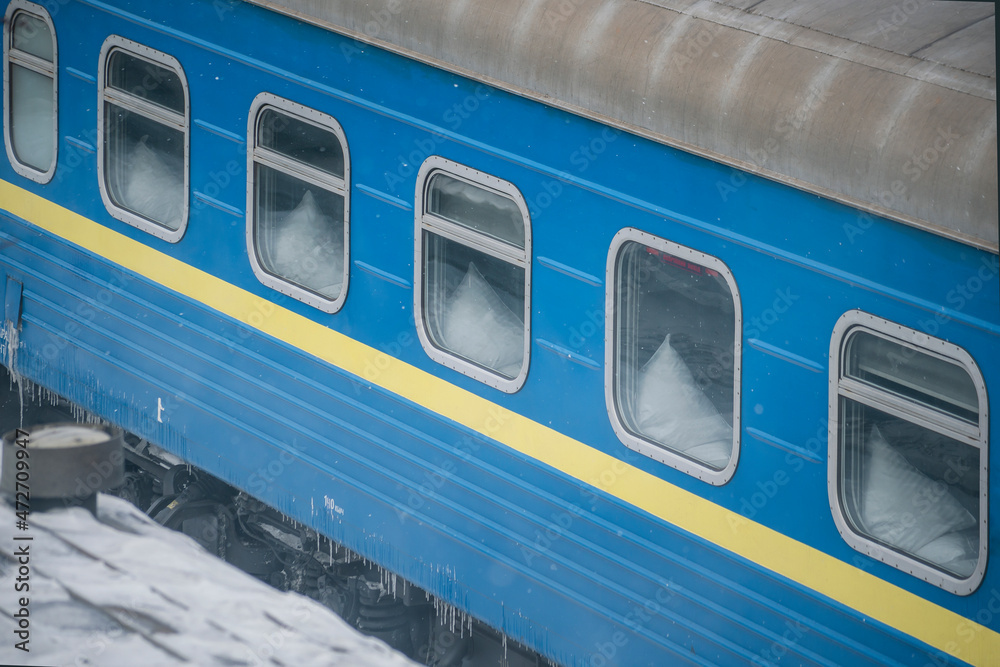 passenger train cars at the station in winter