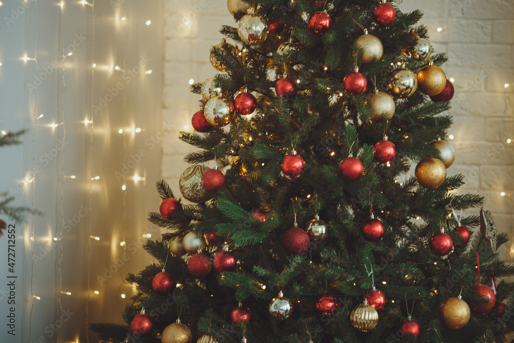 Christmas background. Christmas tree with toys and garlands.