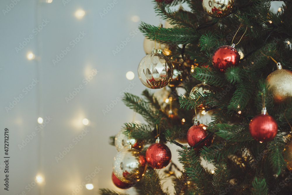 Christmas background. Christmas tree with toys and garlands.