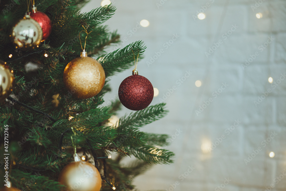 Christmas background. Christmas tree with toys and garlands.