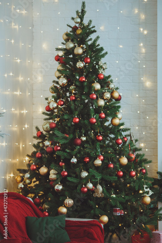 Christmas background. Christmas tree with toys and garlands.