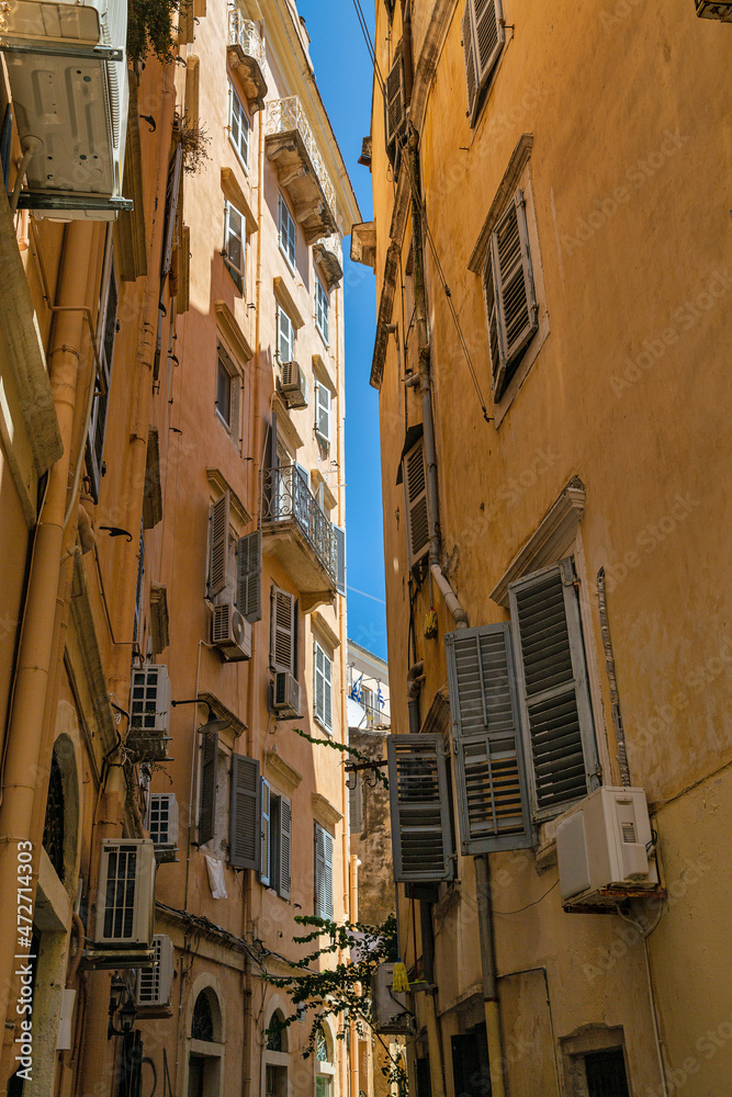 Old narrow street, old buildings on Corfu island, Greece.