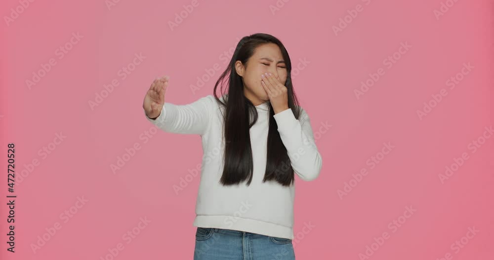 Bad smell. Young asian girl pinching nose to hold breath, feeling disgust to unpleasant odor on pink studio background Bad smell. Young asian girl pinching nose to hold breath, feeling disgust to unpleasant odor on pink studio background