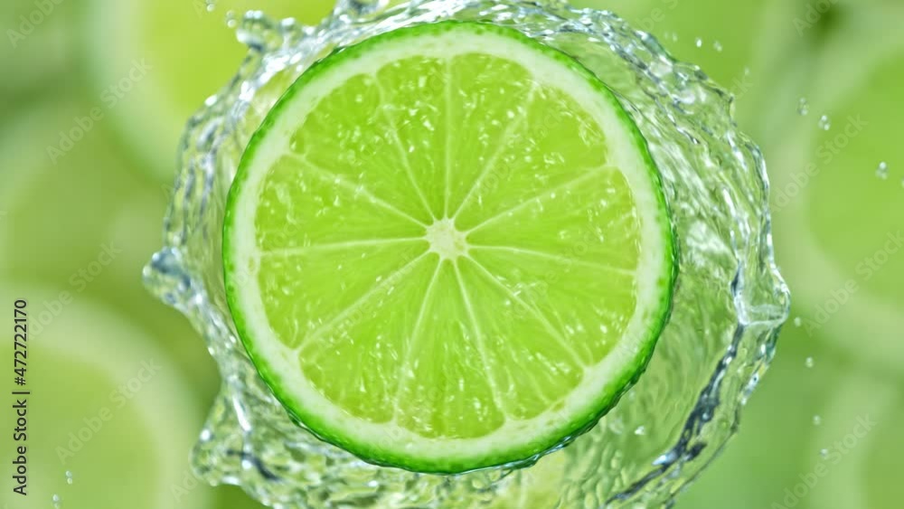 Super Slow Motion Shot of Splashing Water from Rotating Lime Slice at 1000fps. Super Slow Motion Shot of Splashing Water from Rotating Lime Slice at 1000fps.