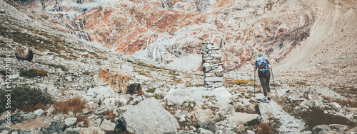 Women walk in mountain with backpack. Trekking and Hiking in nature