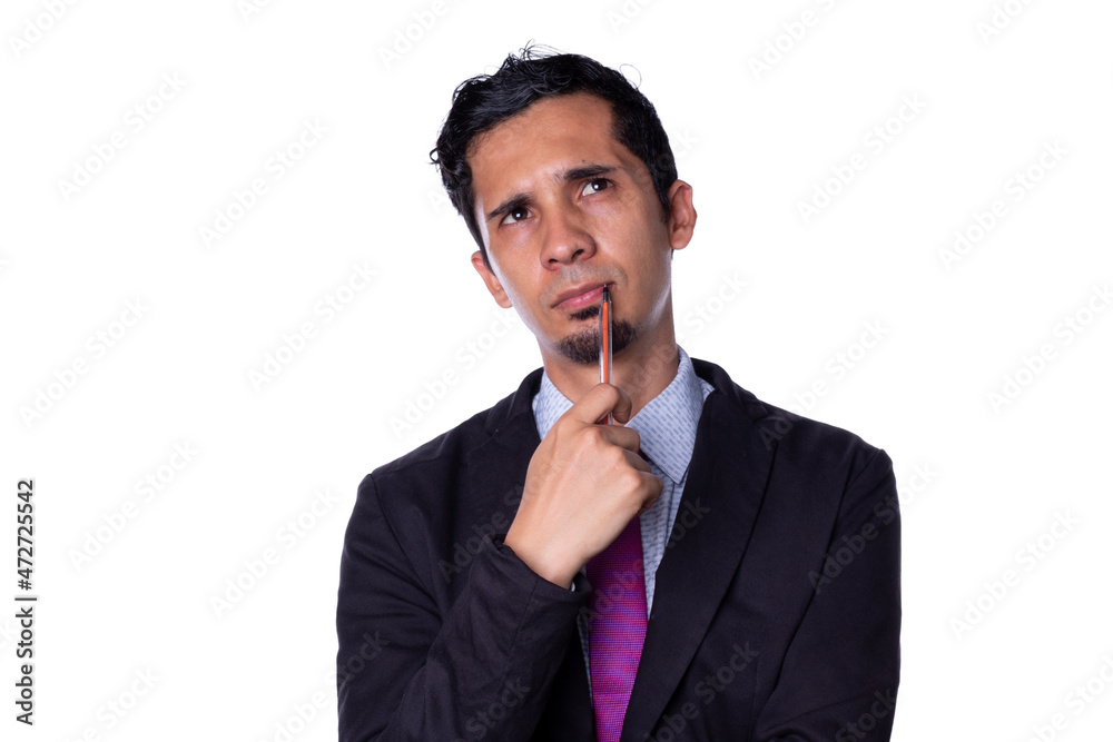 Businessman puts pen in his mouth with thoughtful expression. Young adult thinking about a solution, isolated on all-white background. Businessman puts pen in his mouth with thoughtful expression. Young adult thinking about a solution, isolated on all-white background.