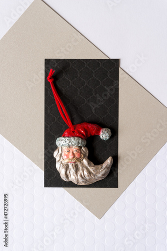 grungy santa face christmas ornament on paper