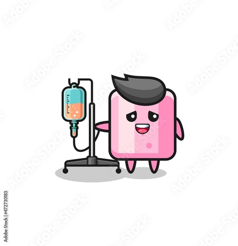 cute marshmallow character standing with infusion pole.