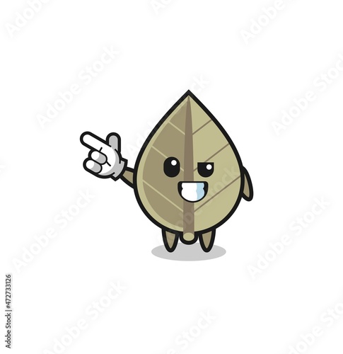 dried leaf mascot pointing top left