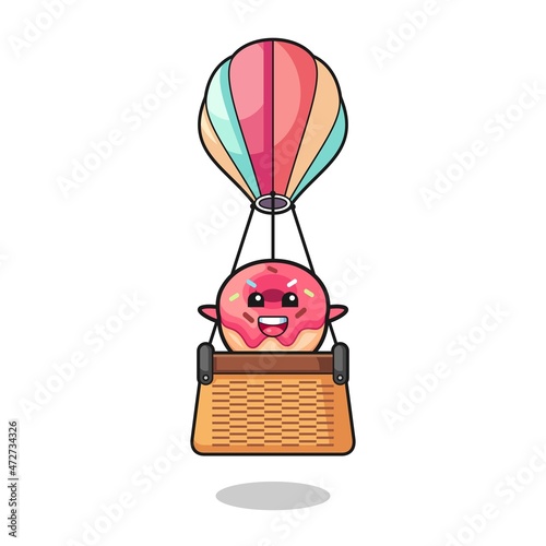 doughnut mascot riding a hot air balloon