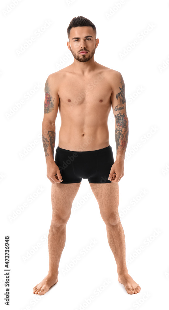 Handsome young man in underwear on white background