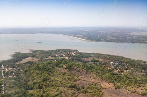 Aerial river and riverbed landscape of India, with nice white clouds in the atmosphere, image shot in the sky from aeroplane. Nature stock image.