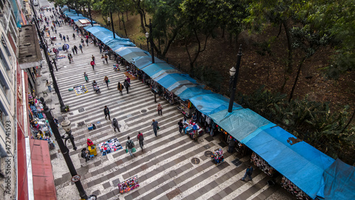 Sao Paulo, Brazil, November 20, 2021. people walk along the General Carneiro street in Sao Paulo, Brazil.	
 photo