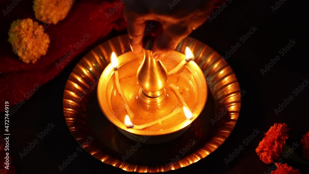 Indian woman holding lighting oil lamp Pongal Onam Diwali vishu celebration Indian festival 4K