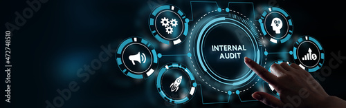 Business, Technology, Internet and network concept. Young businessman working on a virtual screen of the future and sees the inscription: Internal audit