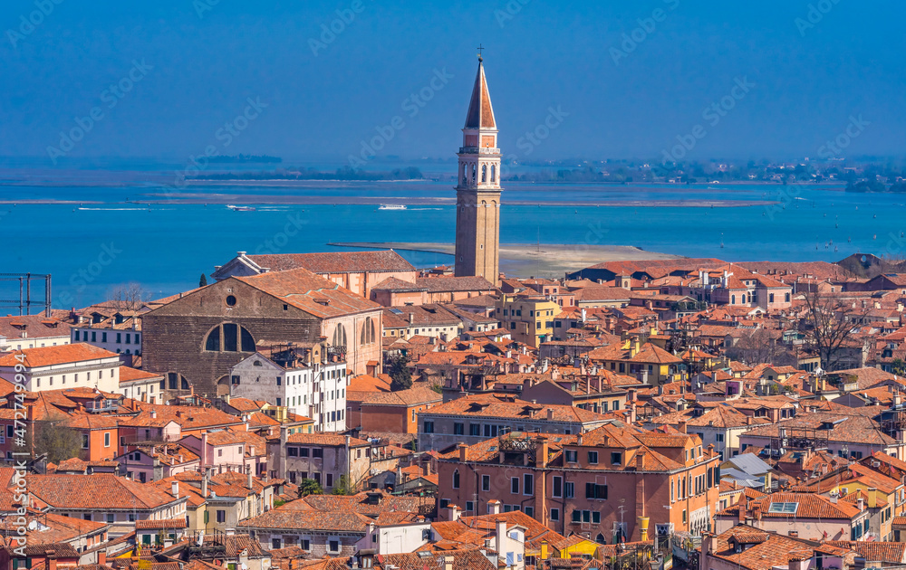 Beautiful orange roofs and neighborhoods, houses and church in Venice, Italy.