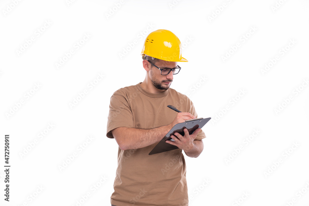 Man Construction Worker Writing in Clipboard Isolated. Man Builder Working with Clipboard. Commecial, Shopping, Advertisment Concept Man Construction Worker Writing in Clipboard Isolated. Man Builder Working with Clipboard. Commecial, Shopping, Advertisment Concept