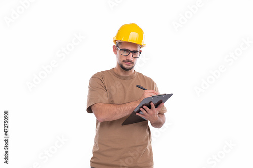 Man Construction Worker Writing in Clipboard Watching in Camera Isolated. Man Builder Working with Clipboard. Commecial, Shopping, Advertisment Concept