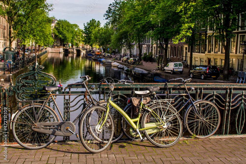 Bicycles on bridge over canal, Amsterdam, Holland, Netherlands.