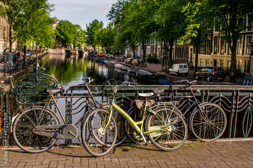 Bicycles on bridge over canal, Amsterdam, Holland, Netherlands.