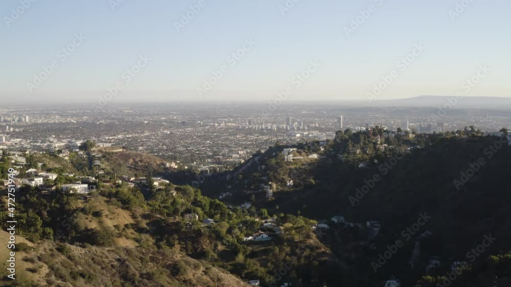 Flying east over the Santa Monica Mountains with a view of the Los Angeles basin to the south. Flying east over the Santa Monica Mountains with a view of the Los Angeles basin to the south.