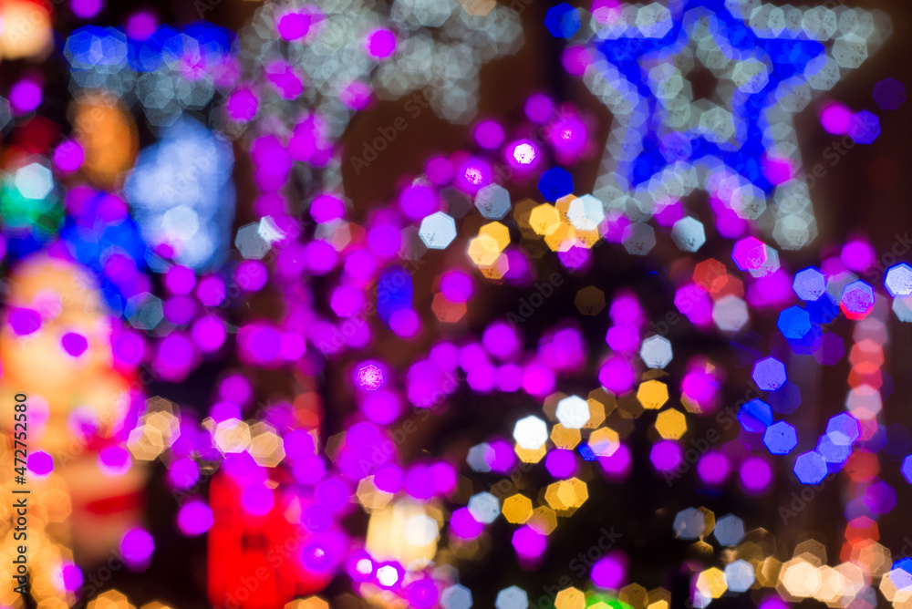CLoseup of Christmas holiday festive glittering defocused colorful background with bokeh lights