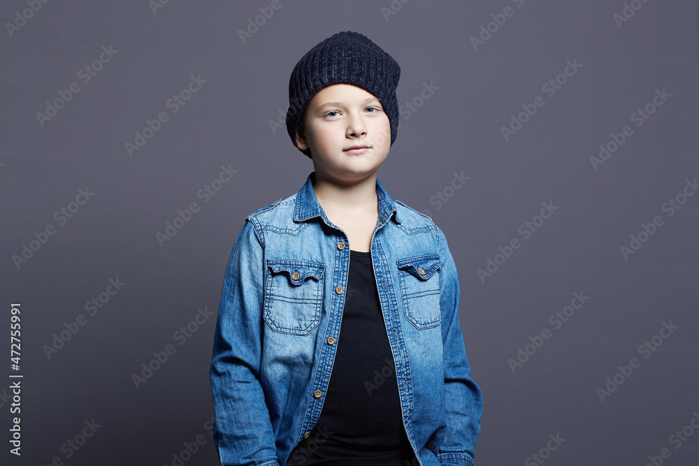 portrait of child. handsome little boy in jeans and hat