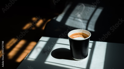 Coffee latte on Black takeaway paper cup
