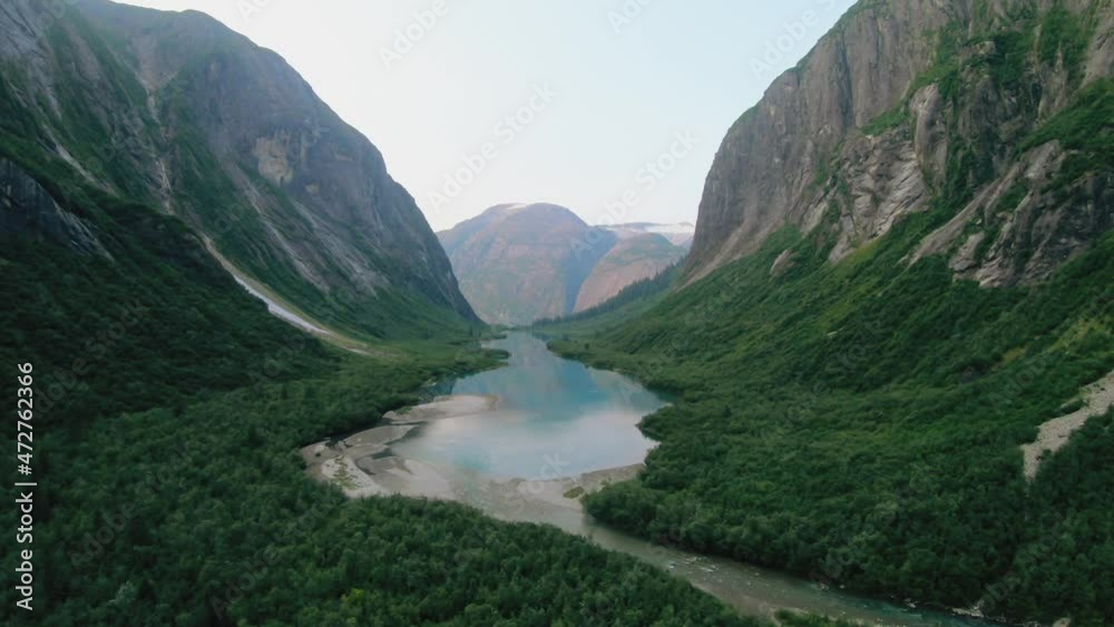 Aerial shooting from flying drone of an beautiful view of mountains and river, Alaska.