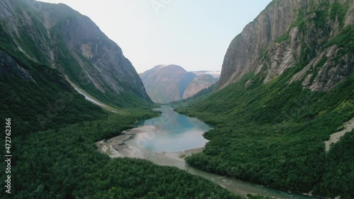 Aerial shooting from flying drone of an beautiful view of mountains and river, Alaska.