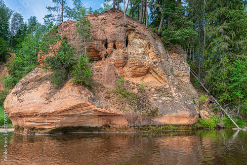The Zvartes Rock is one of the most popular and scenic sandstone outcrops in Latvia. It is located on the left bank of the Amata River in the Gauja National Park. 