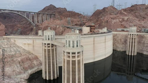 Aerial view of the Hoover Dam and the intake towers with the Mike O'Callaghan–Pat Tillman Memorial Bridge insight.
