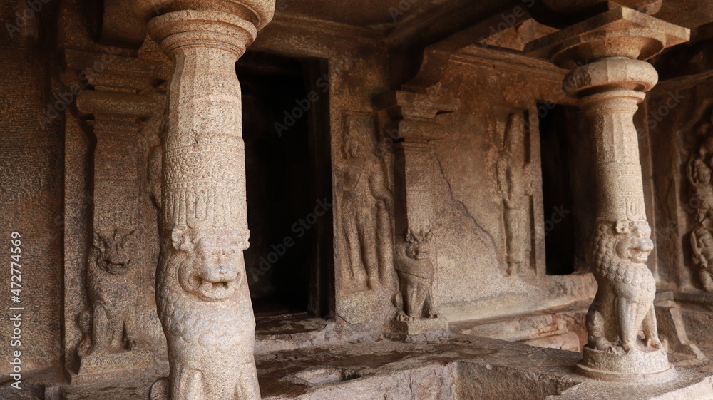 Mahishasuramartini Cave Temple. The pillar carved in the rock is located in the background of the cave temple