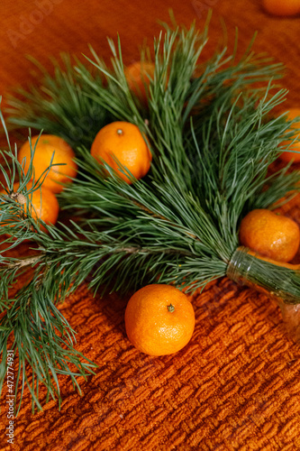 Christmas tree and tangerines on a blanket